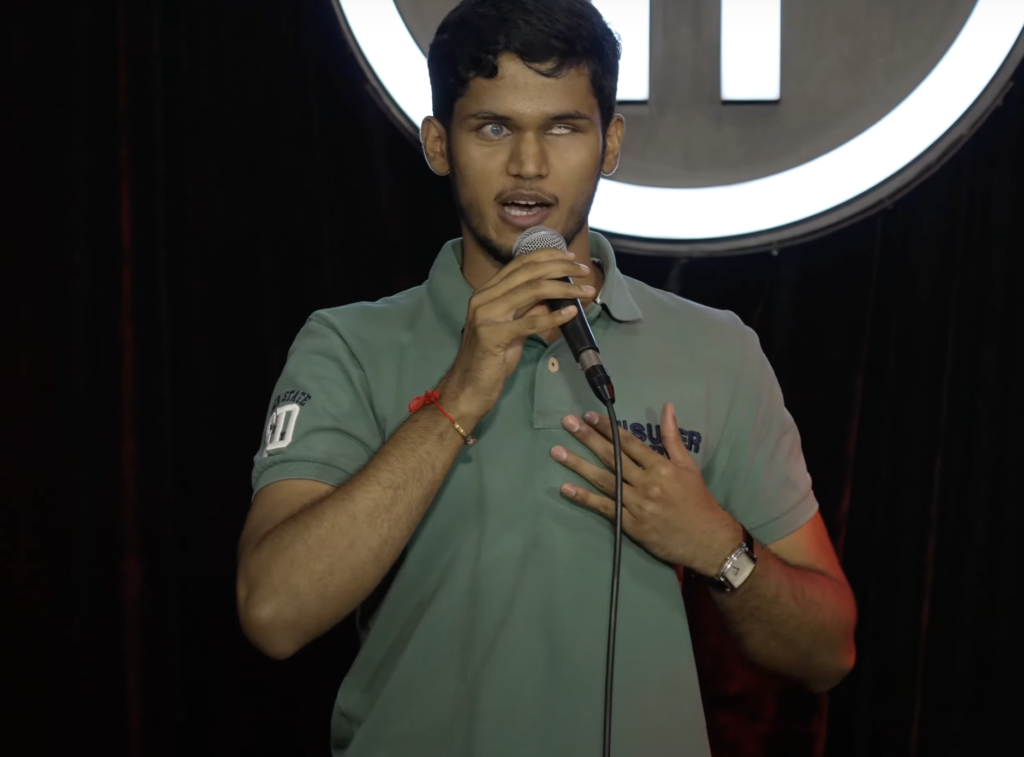 Bhavya Shah, a blind comedian, delivering a stand-up comedy routine at India’s Got Latent, Episode 09, The Habitat, Mumbai.
